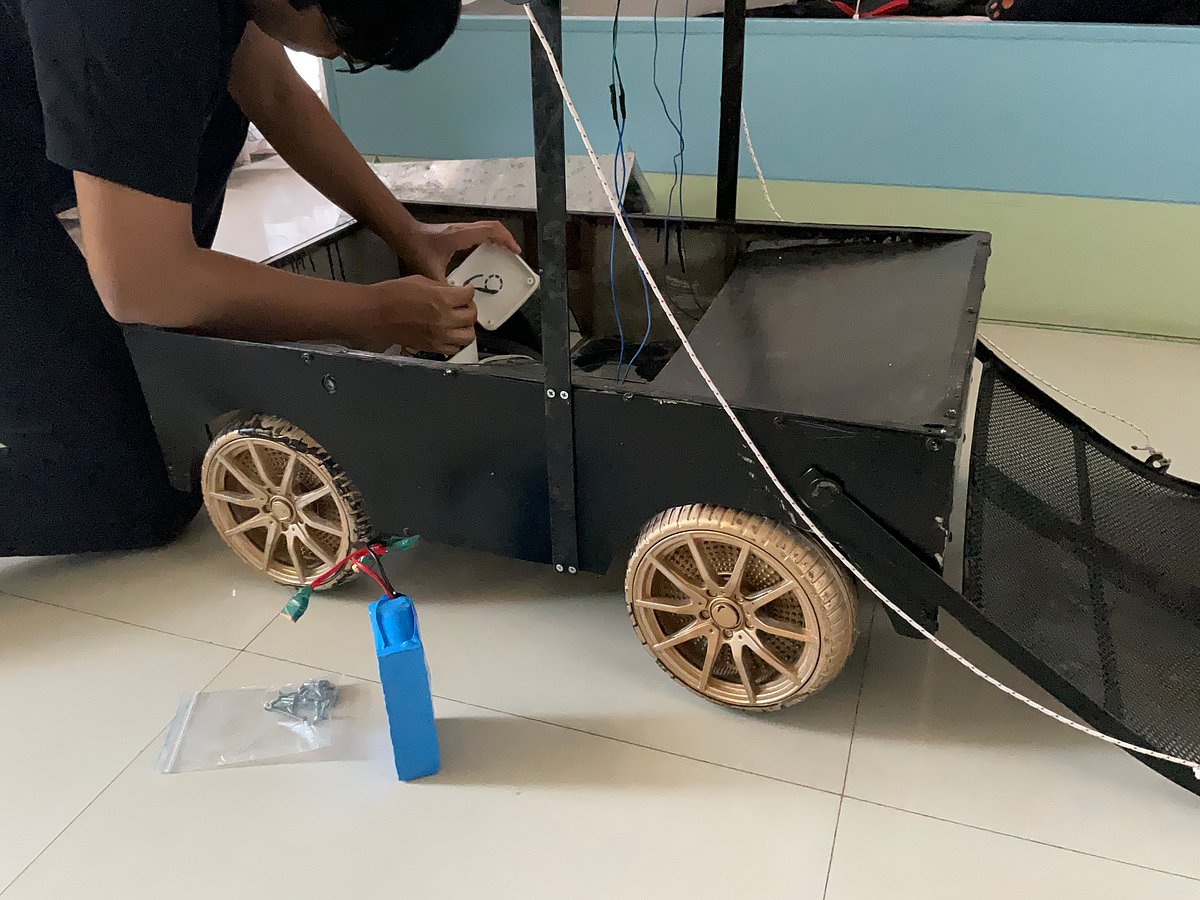 Person working on a robotic vehicle