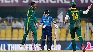 AP Photo/Anupam Nath : South Africa's Ayabonga Khaka, left, celebrates the dismissal of England's Tammy Beaumont during the ICC Women's Cricket World Cup first semifinal match between England and South Africa at Barsapara Cricket Stadium in Guwahati, India, Thursday, Oct. 29, 2025