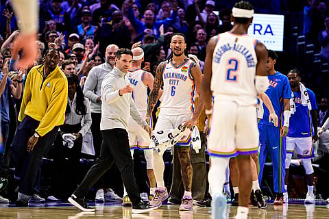 Oklahoma City Thunder Head Coach Mark Daigneault gestures to Oklahoma City Thunder guard Shai Gilgeous-Alexander (2) during the second half of an NBA basketball game between Sacramento Kings and Oklahoma City Thunder in Oklahoma City. 