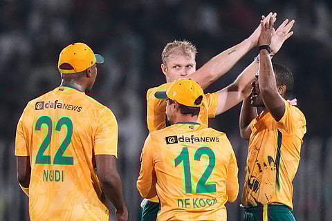 South Africa's Corbin Bosch, center, celebrates with teammates after taking the wicket of Pakistan's Babar Azam during the first T20 cricket match between Pakistan and South Africa, in Rawalpindi, Pakistan.