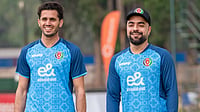 | Photo: X/ACBofficials : Afghanistan's Rashid Khan with his teammate in training ahead of the first T20I match at the Harare Sports Club on October 29, 2025.