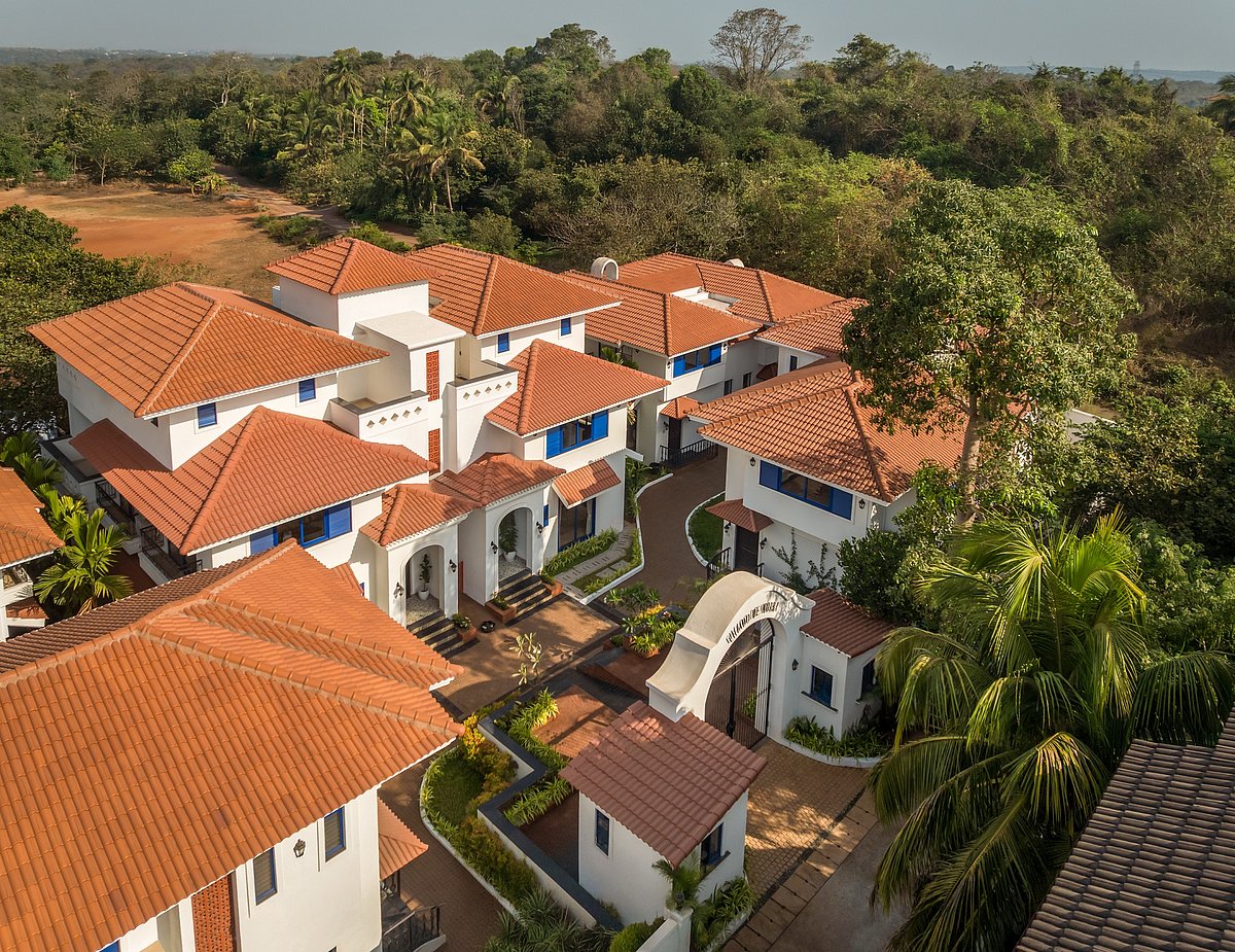 Aerial view of white houses with terracotta roofs