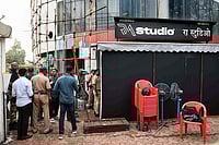 | Photo: PTI : Police personnel at the site where 19 persons including 17 children were rescued from a studio in Powai area while the man who had held them hostage succumbed to bullet injuries sustained during the operation, in Mumbai.