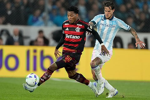 Gonzalo Plata of Brazil's Flamengo (50) and Bruno Zuculini of Argentina's Racing Club battle for the ball during a Copa Libertadores semifinal second leg soccer match in Buenos Aires, Argentina.
