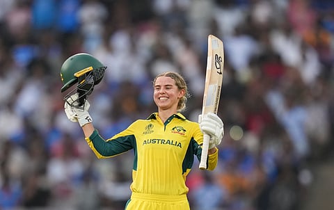Australia's Phoebe Litchfield celebrates her century during an ICC Women's World Cup semifinal ODI cricket match between India Women and Australia Women, at the DY Patil Stadium, in Navi Mumbai.
