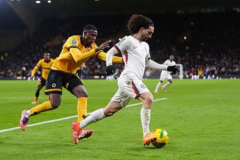Wolverhampton Wanderers vs Chelsea: Wolverhampton Wanderers' Yerson Mosquera, left, and Chelsea's Marc Cucurella battle for the ball during the English League Cup fourth round soccer match between Wolverhampton Wanderers and Chelsea at Molineux Stadium, Wolverhampton, England.