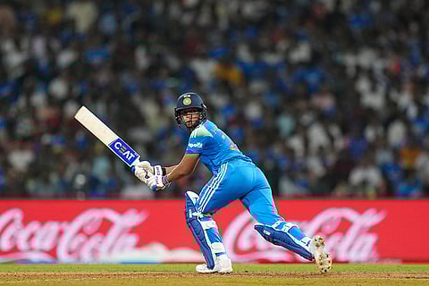 India's captain Harmanpreet Kaur plays a shot during an ICC Women's World Cup semifinal ODI cricket match between India Women and Australia Women, at the DY Patil Stadium, in Navi Mumbai.