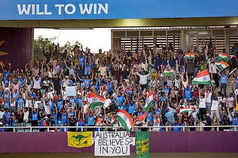 Fans cheer in the stands during an ICC Women's World Cup semifinal ODI cricket match between India Women and Australia Women, at the DY Patil Stadium, in Navi Mumbai.