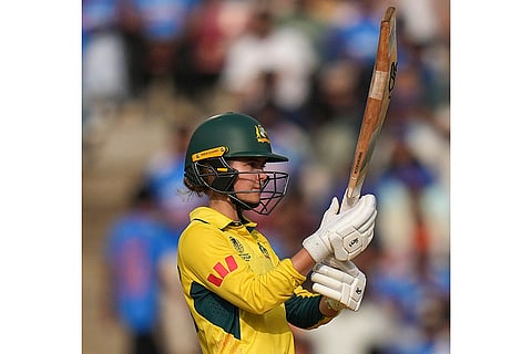 Australia's Phoebe Litchfield celebrates her half century during an ICC Women's World Cup semifinal ODI cricket match between India Women and Australia Women, at the DY Patil Stadium, in Navi Mumbai.
