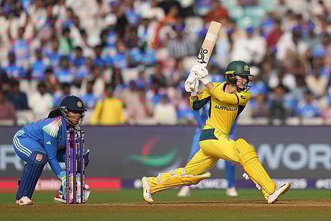 Australia's Phoebe Litchfield plays a shot during an ICC Women's World Cup semifinal ODI cricket match between India Women and Australia Women, at the DY Patil Stadium, in Navi Mumbai.