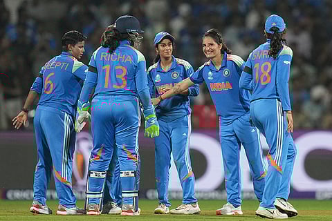 India's players celebrate the wicket of Australia’s Alana King during an ICC Women's World Cup semifinal ODI cricket match between India Women and Australia Women, at the DY Patil Stadium, in Navi Mumbai.
