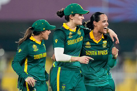 South Africa's players celebrate after winning the ICC Women's Cricket World Cup first semifinal match between England and South Africa at Barsapara Cricket Stadium in Guwahati.