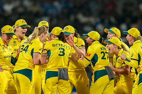 Australia's players celebrate the wicket of India's Shafali Verma during an ICC Women's World Cup semifinal ODI cricket match between India Women and Australia Women, at the DY Patil Stadium, in Navi Mumbai.