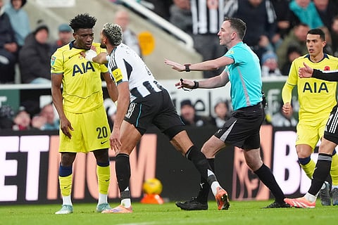 Newcastle vs Tottenham: Newcastle United's Joelinton, left, argues with Tottenham Hotspur's Mohammed Kudus during the English League Cup fourth round soccer match between Newcastle United and Tottenham Hotspur in Newcastle, England.