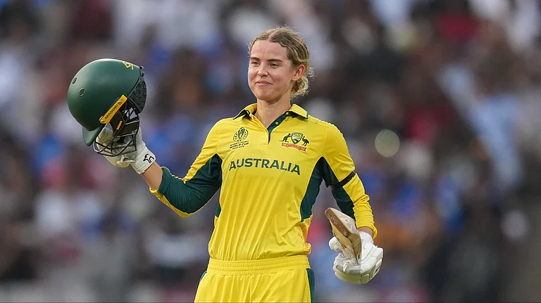 Australia's Phoebe Litchfield celebrates her century during an ICC Women's World Cup semifinal ODI cricket match between India Women and Australia Women, at the DY Patil Stadium. - Kunal Patil/PTI