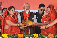 | Photo: PTI : Political Capital: Prime Minister Narendra Modi being felicitated at a public meeting in Begusarai district