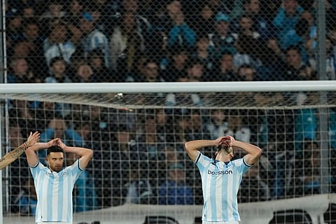 Luciano Vietto, right, and Adrian Martinez of Argentina's Racing Club react during a Copa Libertadores semifinal second leg soccer match against Brazil's Flamengo in Buenos Aires, Argentina.