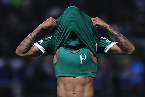 Allan of Brazil's Palmeiras reacts after missing a chance to score against Ecuador's Liga Deportiva Universitaria during a Copa Libertadores semifinal second leg soccer match in Sao Paulo.