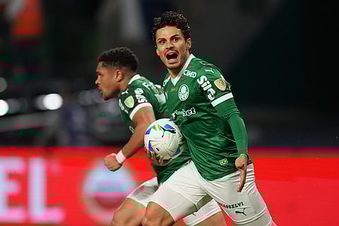 Raphael Veiga of Brazil's Palmeiras, front, celebrates after scoring his side's third goal against Ecuador's Liga Deportiva Universitaria during a Copa Libertadores semifinal second leg soccer match in Sao Paulo.