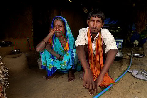 Bharti Devi (50), a widow from the Manjhi community, sits with her son, a testament to the gaping hole between political rhetoric and ground reality