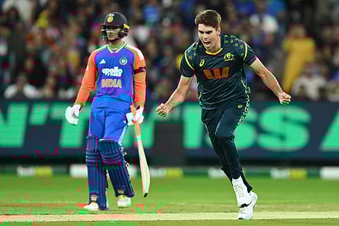 Australia's Xavier Bartlett, right, celebrates after dismissing India's Harshit Rana during their T20 cricket match in Melbourne, Australia.