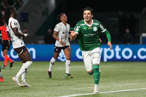 Raphael Veiga of Brazil's Palmeiras celebrates after scoring his side's fourth goal against Ecuador's Liga Deportiva Universitaria during a Copa Libertadores semifinal second leg soccer match in Sao Paulo.