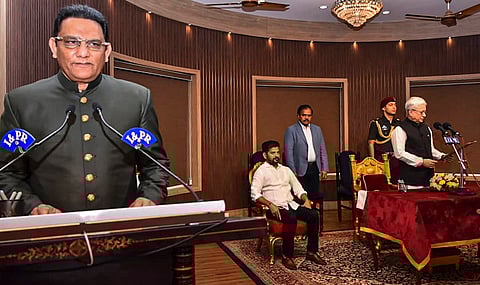 Telangana Governor Jishnu Dev Verma administers oath to Congress leader and former cricketer Mohammad Azharuddin during his swearing-in ceremony as a state minister, at Raj Bhavan, in Hyderabad. Chief Minister A Revanth Reddy is also seen. 