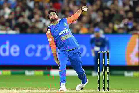 India's Kuldeep Yadav bowls against Australia during their T20 cricket match in Melbourne, Australia.