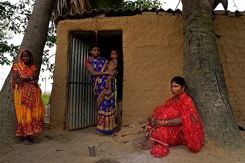 Punia Devi and her family from the Manjhi community. Being landless laborers, they depend on government rations and a hope for a better future.
