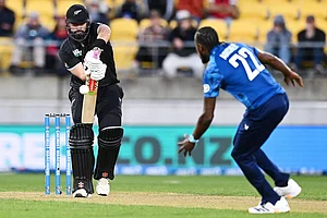 | Photo: Kerry Marshall/Photosport via AP : Daryl Mitchell of New Zealand plays the ball towards England's Jofra Archer during the One Day International cricket match between New Zealand and England in Wellington, New Zealand.