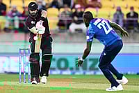 | Photo: Kerry Marshall/Photosport via AP : Daryl Mitchell of New Zealand plays the ball towards England's Jofra Archer during the One Day International cricket match between New Zealand and England in Wellington, New Zealand.