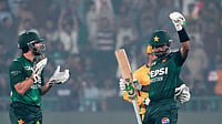 (AP Photo/K.M. Chaudary) : Pakistan's Babar Azam, left, celebrates after scoring fifty during the third T20 cricket match between Pakistan and South Africa, in Lahore, Pakistan, Saturday, Nov. 1, 2025.
