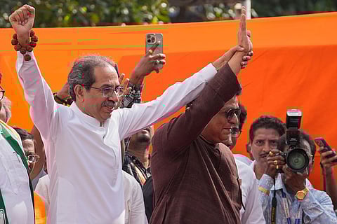 Shivsena Uddhav Balasaheb Thackeray, (UBT) party leader Uddhav Thackeray, left, and Maharashtra Navnirman Sena (MNS) party leader Raj Thackeray wave their hand during a march organized by Maharashtra Navnirman Sena (MNS) and the Maha Vikas Aghadi (MVA) to protest against alleged manipulation of Maharashtra's electoral rolls in Mumbai, India.