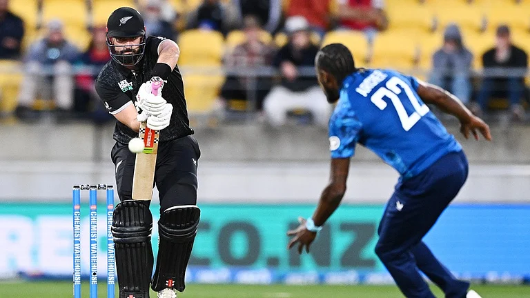 Daryl Mitchell of New Zealand plays the ball towards England's Jofra Archer during the third one-day international in Wellington. - Photo: Kerry Marshall/Photosport via AP