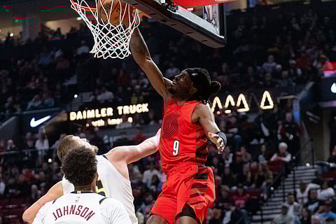 Portland Trail Blazers forward Jerami Grant (9) dunks the ball during the second half of an NBA Cup basketball game against the Denver Nuggets in Portland, Ore.