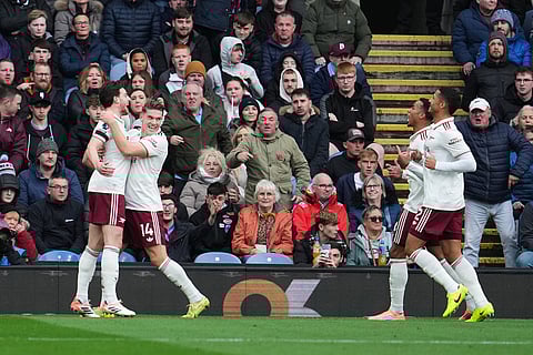 Arsenal's Viktor Gyoekeres, second left, , celebrates with Arsenal's Declan Rice after scoring his side's opening goal during the English Premier League soccer match between Burnley and Arsenal in Burnley, England.
