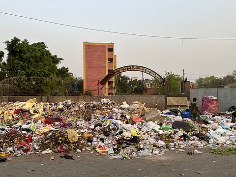 A large garbage dump right behind a government school in Tilak Vihar.