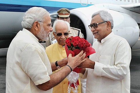 Dumps RJD, rejoins NDA in 2017 another political pivot. Narendra Modi, Keshari Nath Tripathi, Nitish Kumar at Patna airport in Patna