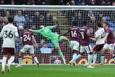 Burnley's goalkeeper Martin Dubravka dives but fails to save the goal from Arsenal's Declan Rice, second right, during the English Premier League soccer match between Burnley and Arsenal in Burnley, England.
