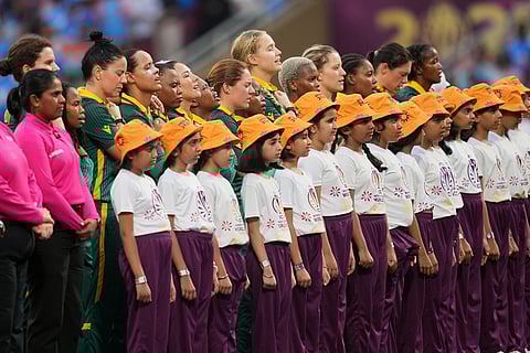 South Africa's players stand for their national anthem before start the ICC Women's Cricket World Cup final match between India and South Africa in Navi Mumbai.