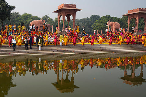 People gather to offer prayers on the first day of the Yamunotsav 2025 as part of the Yamuna Sansad's campaign, at Vasudev Ghat on the banks of the Yamuna, in New Delhi.