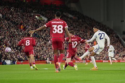 Aston Villa's Morgan Rogers makes an attempt to score during the English Premier League soccer match between Liverpool and Aston Villa in Liverpool, England.