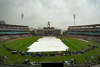 India Vs South Africa Final, ICC Women's World Cup: See Best Photos From Navi Mumbai's DY Patil Stadium | Photo: PTI/Kunal Patil : Groundsmen cover the field amid rain at the DY Patil Stadium ahead of the ICC Women's World Cup 2025 cricket final match between India Women and South Africa Women, in Navi Mumbai.