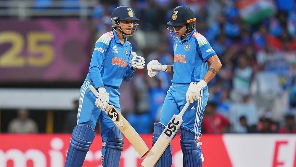 | Photo: AP/Rafiq Maqbool : India's Shafali Verma, right, and India's Smriti Mandhana celebrate after hitting a four during the ICC Women's Cricket World Cup final match between India and South Africa in Navi Mumbai.