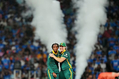 South Africa's Ayabonga Khaka, left, celebrates the dismissal of India's Richa Ghosh during the ICC Women's Cricket World Cup final match between India and South Africa in Navi Mumbai.