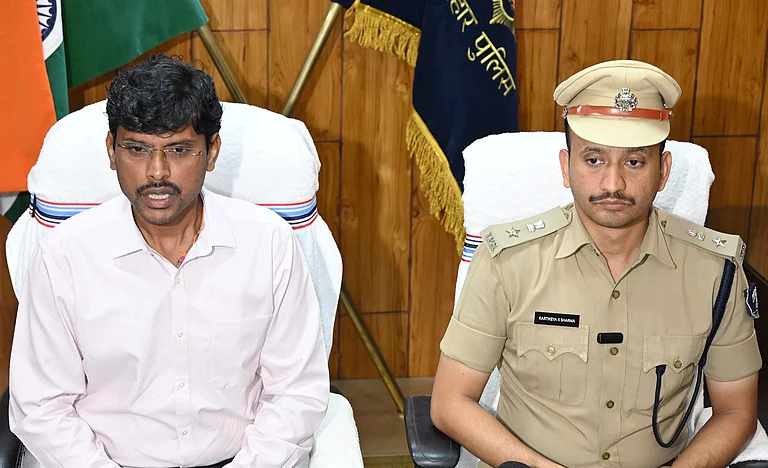 Patna: DM Thiyagarajan S.M. (left) and SSP Kartikeya K. Sharma during a press conference after Mokama JD(U) candidate Anant Kumar Singh was arrested along with two associates, Manikant Thakur and Ranjit Ram. - null