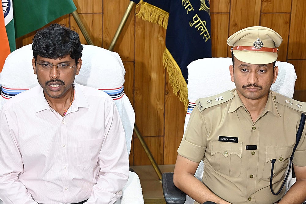 | Photo: PTI : DM Thiyagarajan S.M. (left) and SSP Kartikeya K. Sharma during a press conference after Mokama JD(U) candidate Anant Kumar Singh was arrested along with two associates, Manikant Thakur and Ranjit Ram, from Bedna village in connection with a serious election code violation, in Patna.