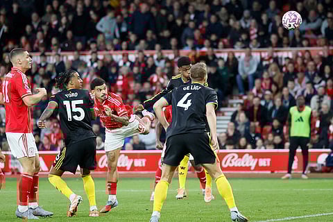 Nottingham Forest's Morgan Gibbs-White, third left, scores during the English Premier League match between Nottingham Forest and Manchester United in Nottingham, England.