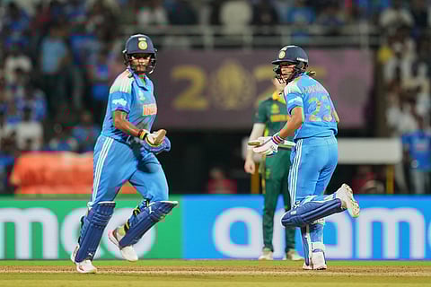 India's captain Harmanpreet Kaur, right, and India's Deepti Sharma run between the wickets to score during the ICC Women's Cricket World Cup final match between India and South Africa in Navi Mumbai.