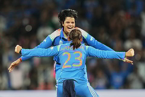 India's captain Harmanpreet Kaur and India's Shafali Verma celebrates the dismissal of South Africa's Sune Luus during the ICC Women's Cricket World Cup final match between India and South Africa in Navi Mumbai.